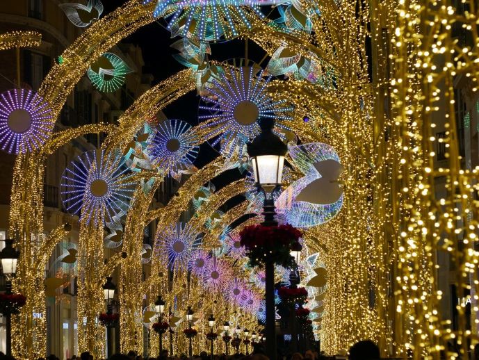 Lights illuminating streets in colors of gold, blue and red for holiday season 