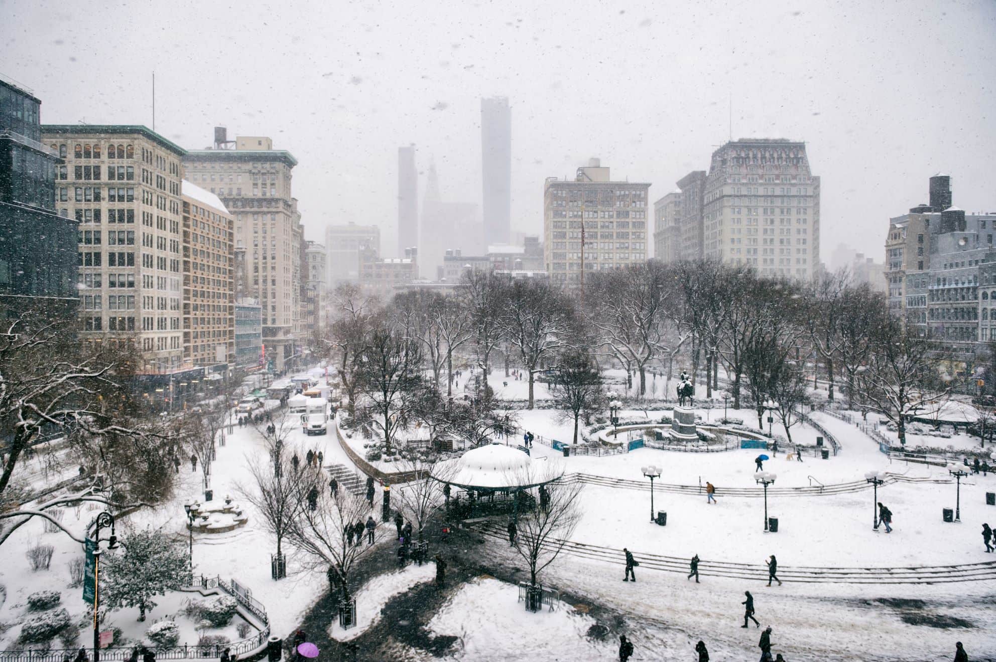 Snowy winter scene with trails left by pedestrians in the snow in Union Square as a blizzard overtakes Union Square